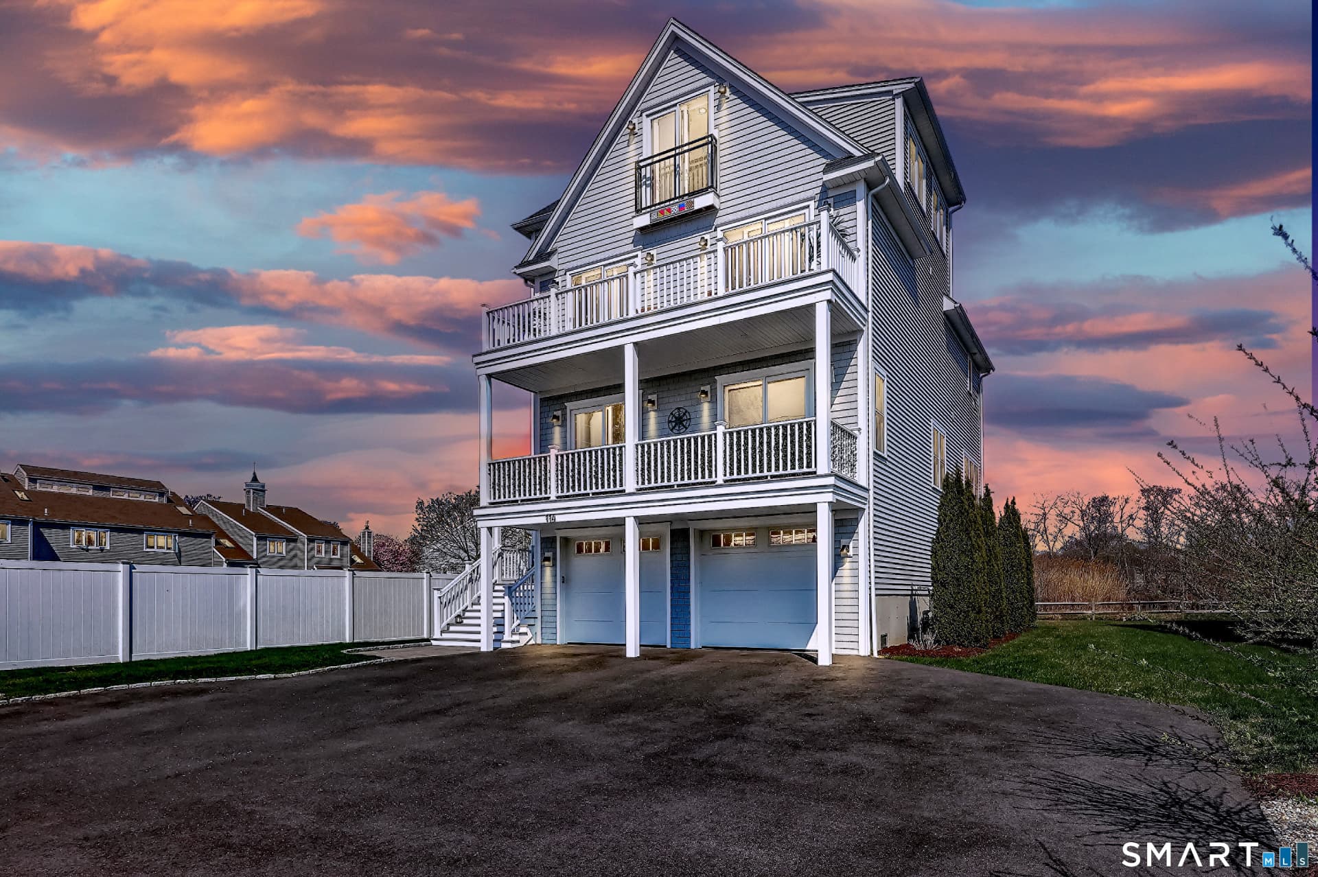 Twilight front exterior with warm interior lights